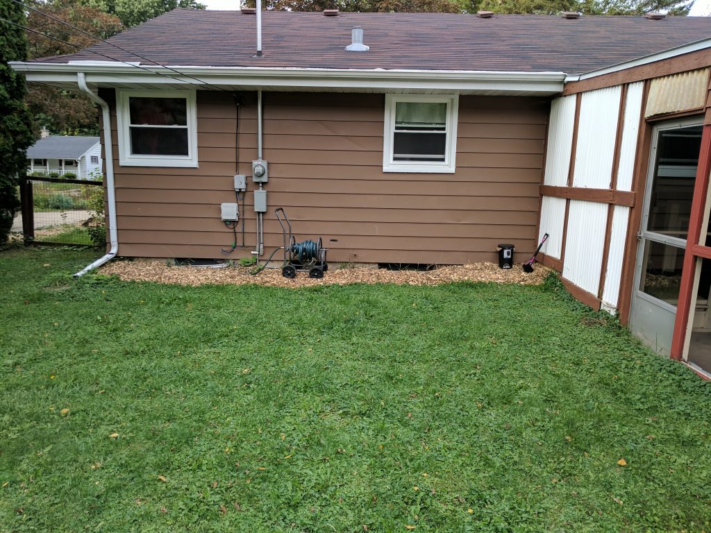 The back of the house, mulched