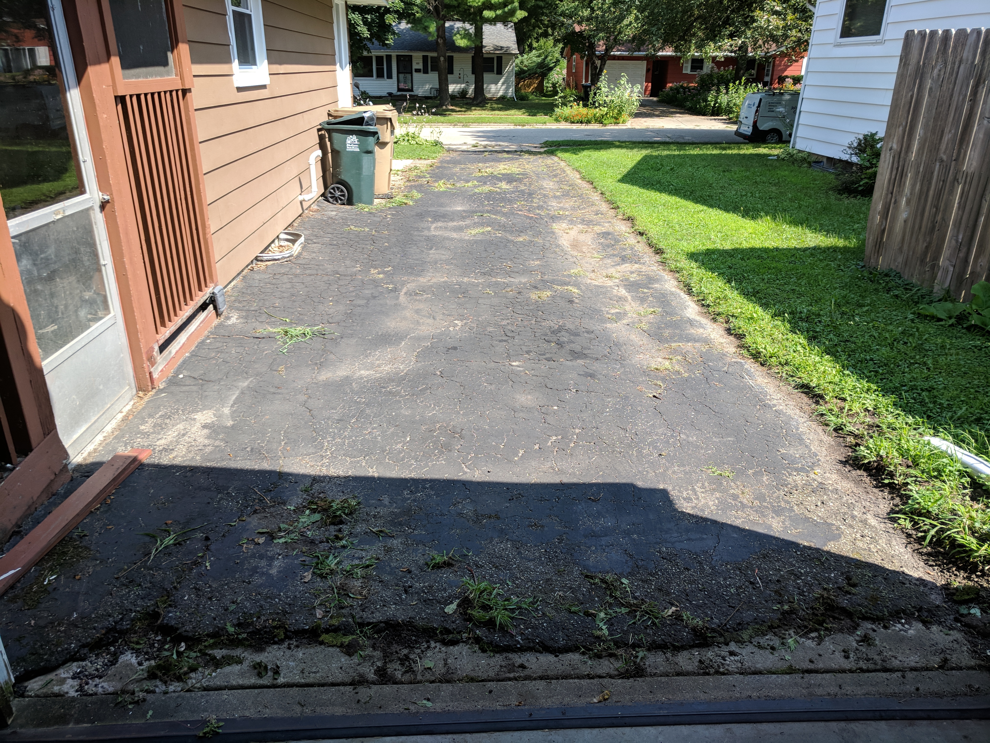 Driveway Resurfacing after weeds cleaned