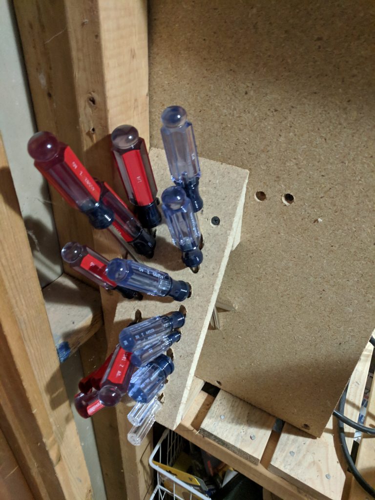 pegboard wall old screwdriver setup